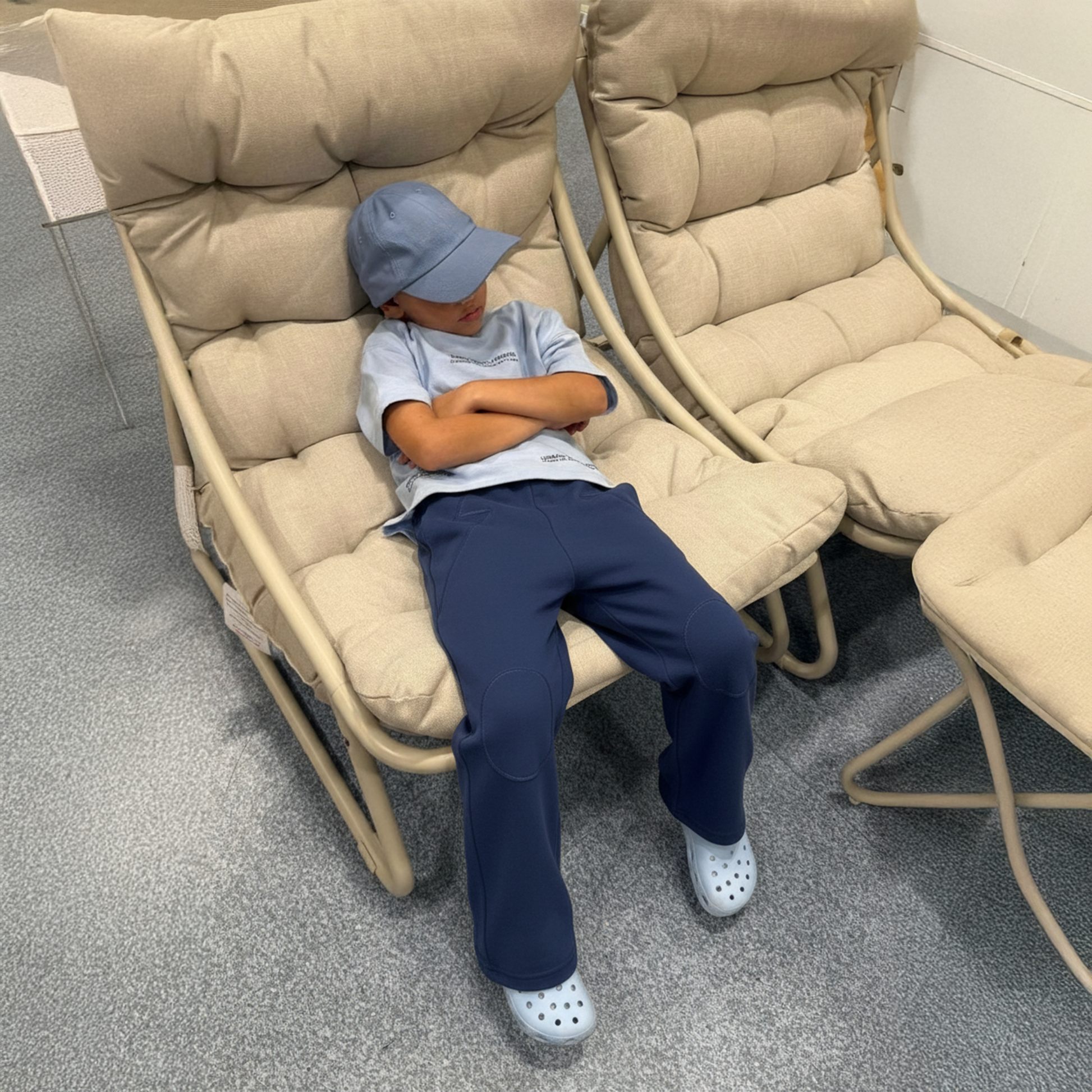 child wearing Blue Jogiel Flared Pants sitting on lounge chair